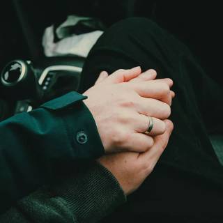 Hand holding phone wallpaper