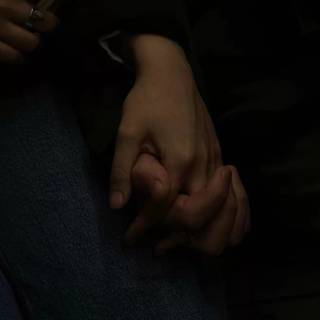 Hand holding phone wallpaper