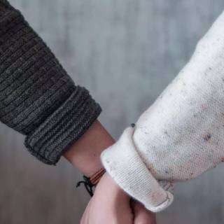 Hand holding phone wallpaper