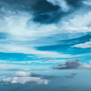 Blue clouds iPhone wallpaper