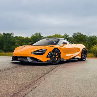 McLaren 765LT orange on road wallpaper