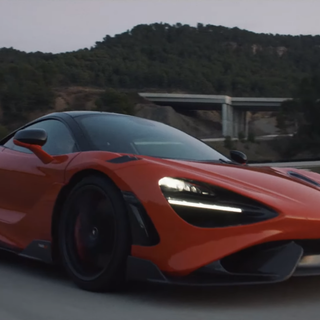 McLaren 765LT orange on road wallpaper