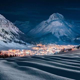 Moonlit winter village wallpaper