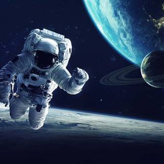 Astronaut near planet wallpaper