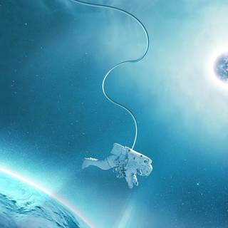 Astronaut near planet wallpaper