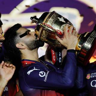 Virat Kohli with trophy wallpaper