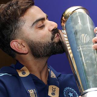 Virat Kohli with trophy wallpaper
