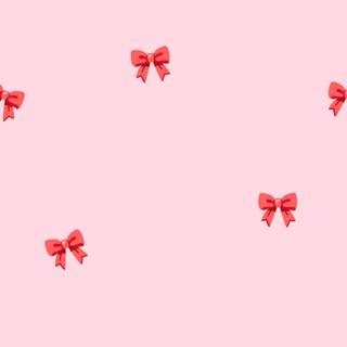 Pink Christmas bow wallpaper
