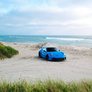 Car on beach wallpaper