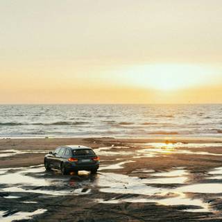 Car on beach wallpaper