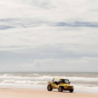 Car on beach wallpaper
