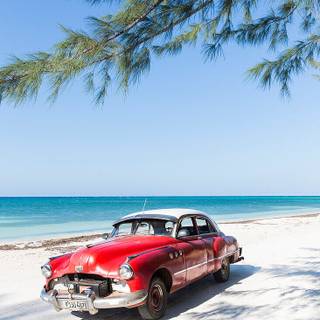 Car on beach wallpaper
