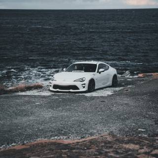 Car on beach wallpaper