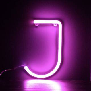 Purple neon letter J wallpaper