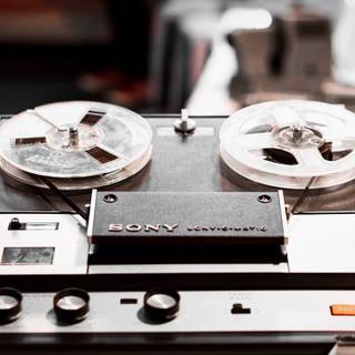 Reel-to-reel audio tape recording wallpaper