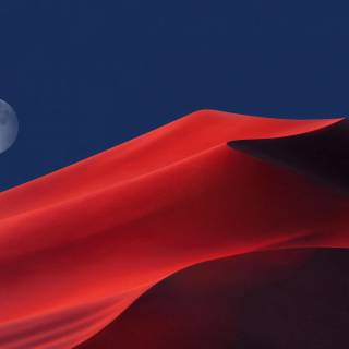 Full moon over red dunes wallpaper