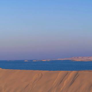 Full moon over red dunes wallpaper