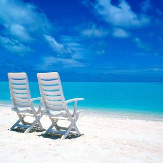 Chairs on the beach wallpaper