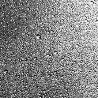 Glass with drops of water wallpaper