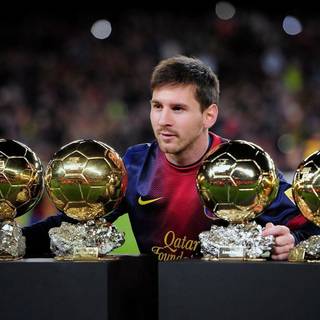 Messi with Ballon d'Or wallpaper