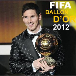Messi with Ballon d'Or wallpaper