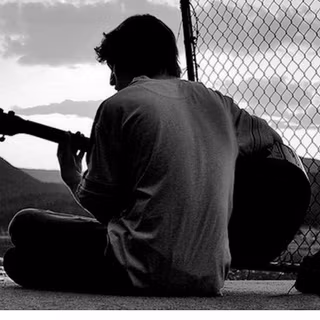 Sad boy with guitar wallpaper