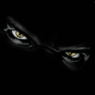 Evil green eyes wallpaper