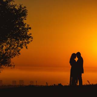 Romantic couple sunset silhouette wallpaper