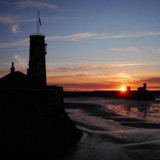 Sunset watchtower seascape wallpaper