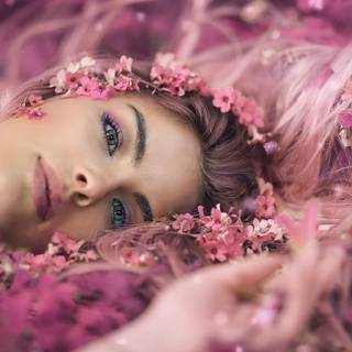 Female lying flowers wallpaper