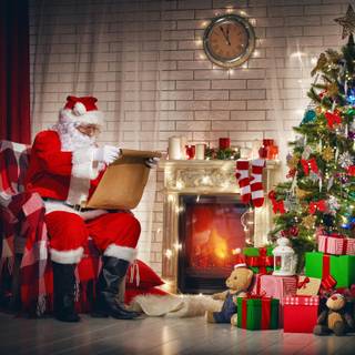 Santa gifts under tree wallpaper