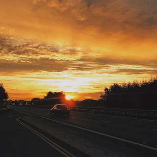 Sunset with cars wallpaper