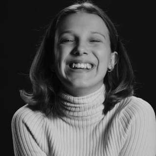 Millie Bobby Brown smiling wallpaper