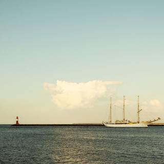 Lighhouse and boat wallpaper