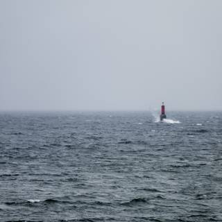Lighthouse stormy sea wallpaper