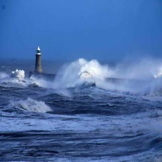 Lighthouse stormy sea wallpaper