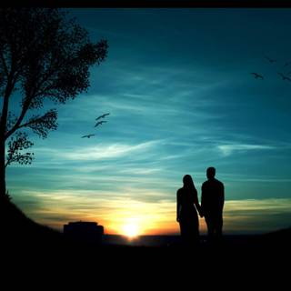 Sunset couple silhouette wallpaper