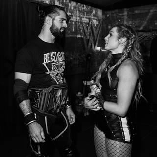 Becky Lynch and Seth Rollins HD wallpaper