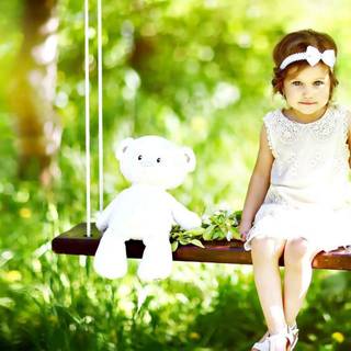 Child alone at swing wallpaper