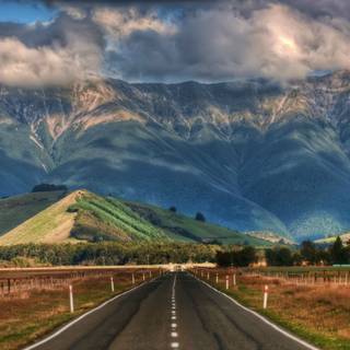 Road mountain clouds wallpaper