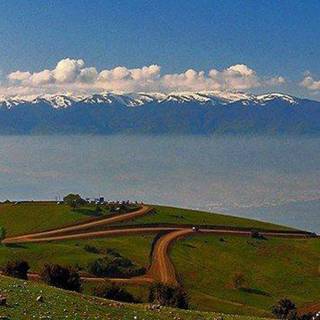 Road mountain clouds wallpaper