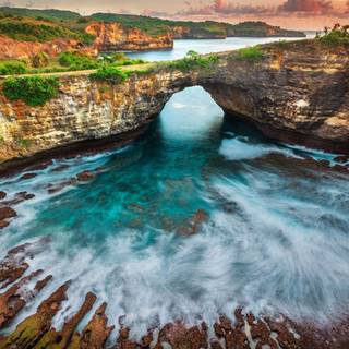 Sunset bridge sea rocks clouds wallpaper