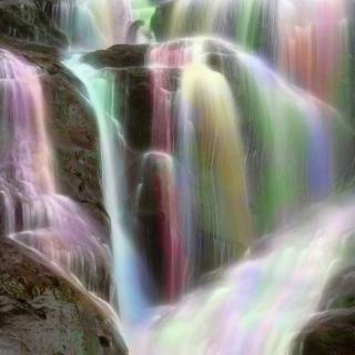 Rainbow over water cascades wallpaper