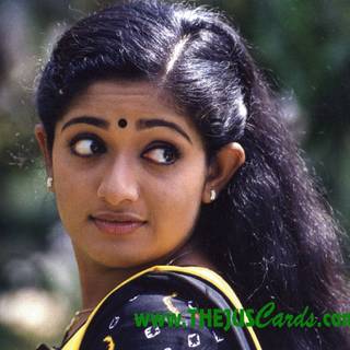 Kavya Madhavan close up wallpaper