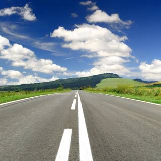 Empty road clouds mountains HD wallpaper