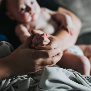 New born baby with women wallpaper