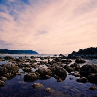 Beach rock sky HD wallpaper