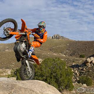 Dirt bike doing wheelies wallpaper