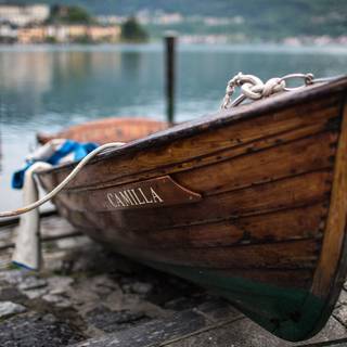 Wooden boat in river wallpaper