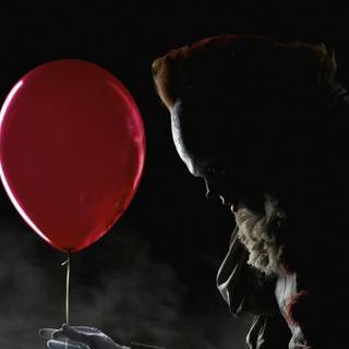 Pennywise giving balloon wallpaper